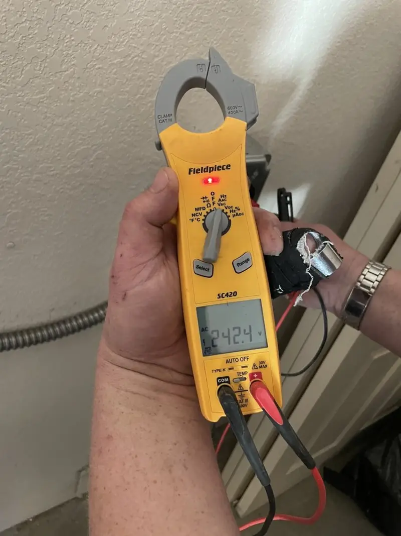 Voltage testing with clamp meter during Recessed Lighting Installation in Marseilles